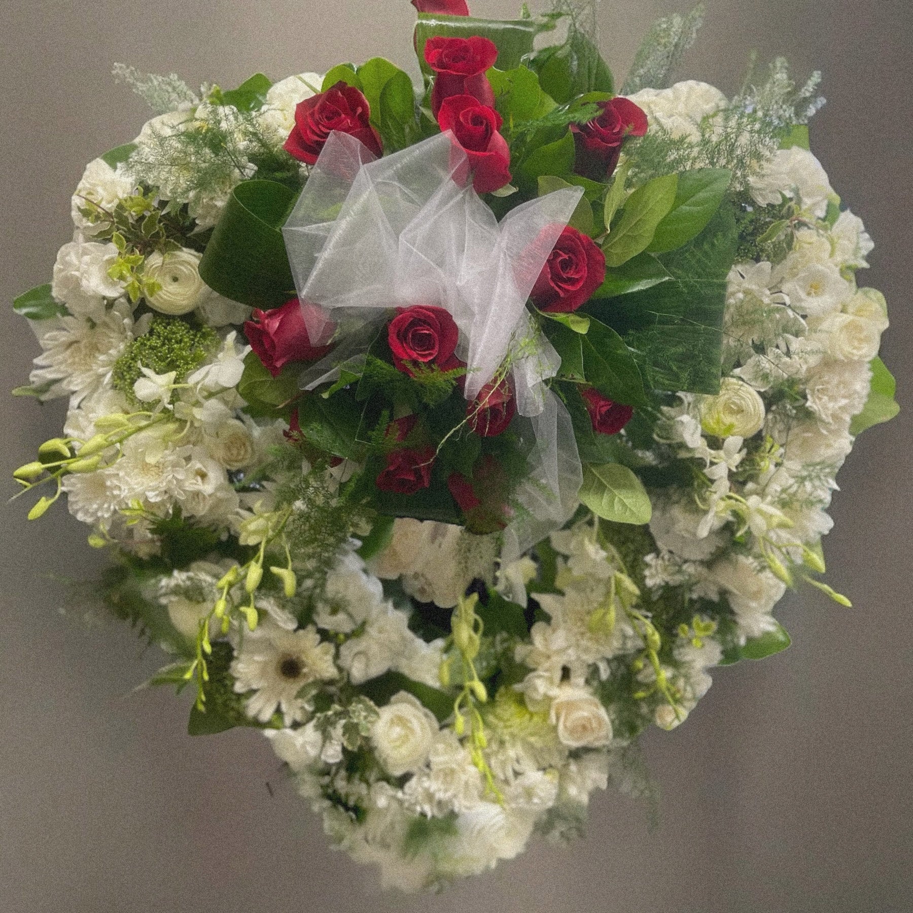 Heartfelt Elegance Wreath with red roses and white flowers for sympathy and funeral in Toronto, luxury same-day delivery.