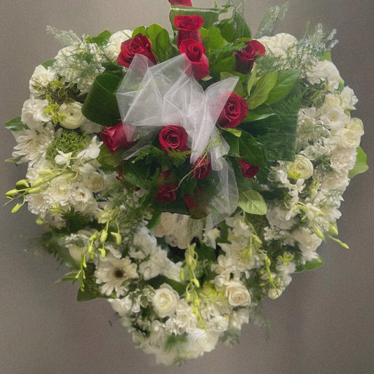 Heartfelt Elegance Wreath with red roses and white flowers for sympathy and funeral in Toronto, luxury same-day delivery.