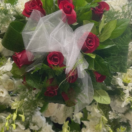 Heartfelt Elegance Wreath with red roses and white flowers, ideal for sympathy and funeral arrangements. Luxury, same day delivery in Toronto.