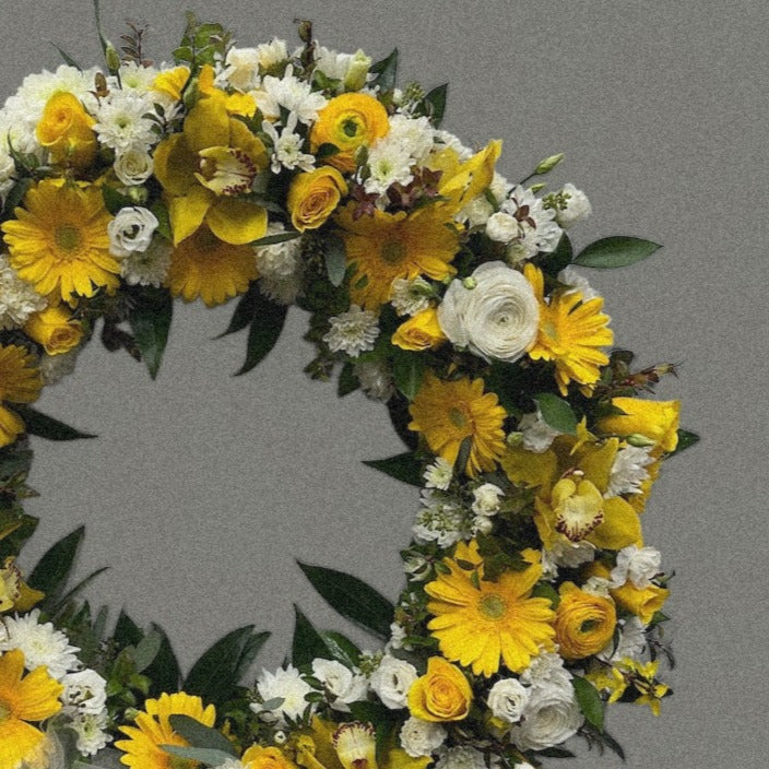 Vintage Sunburst Wreath with yellow roses and daisies for sympathy or funeral, best in Toronto, same day delivery.