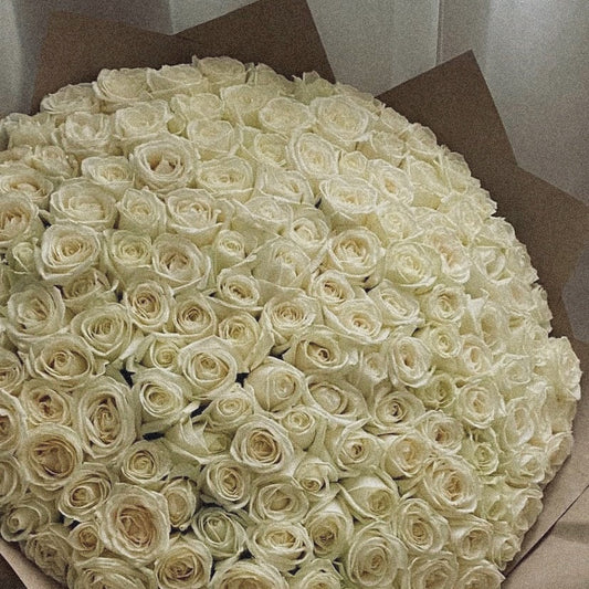 Fresh 100 white rose bouquet, representing purity and elegance, perfect for weddings and sympathy gestures