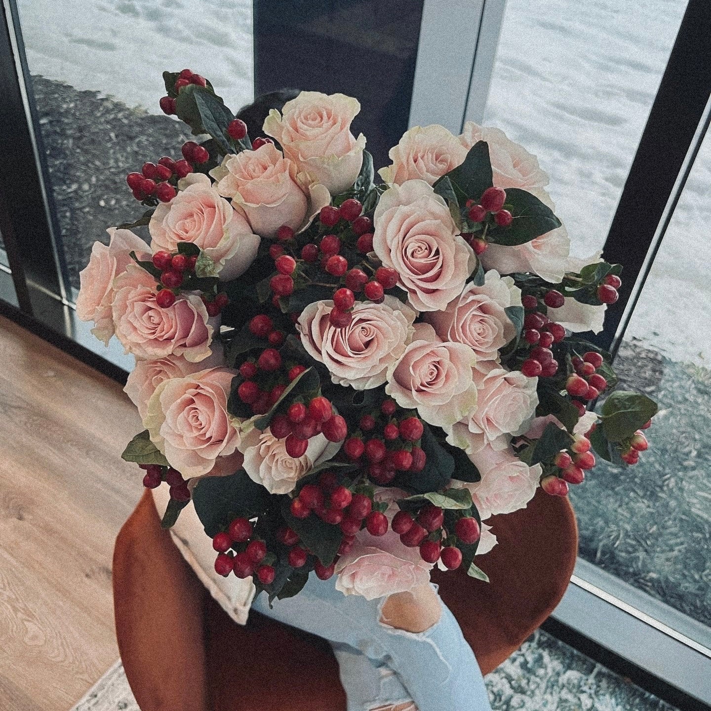 Love-inspired flower arrangement with red tulips, roses, and heart-shaped accents, the ultimate gift for anniversaries