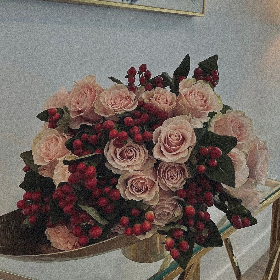 Love-inspired flower arrangement with red tulips, roses, and heart-shaped accents, the ultimate gift for anniversaries
