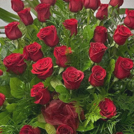 Grand bouquet of premium red roses; luxury sympathy funeral arrangement with same-day delivery in Toronto and GTA.
