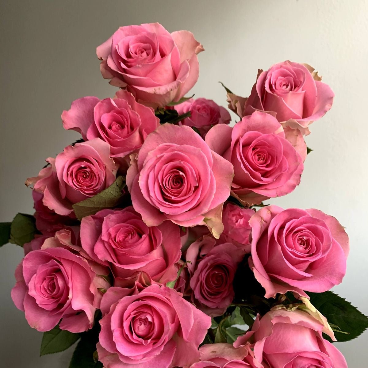 Stunning arrangement of premium long-stemmed roses in a luxury vase, ideal for special gifts