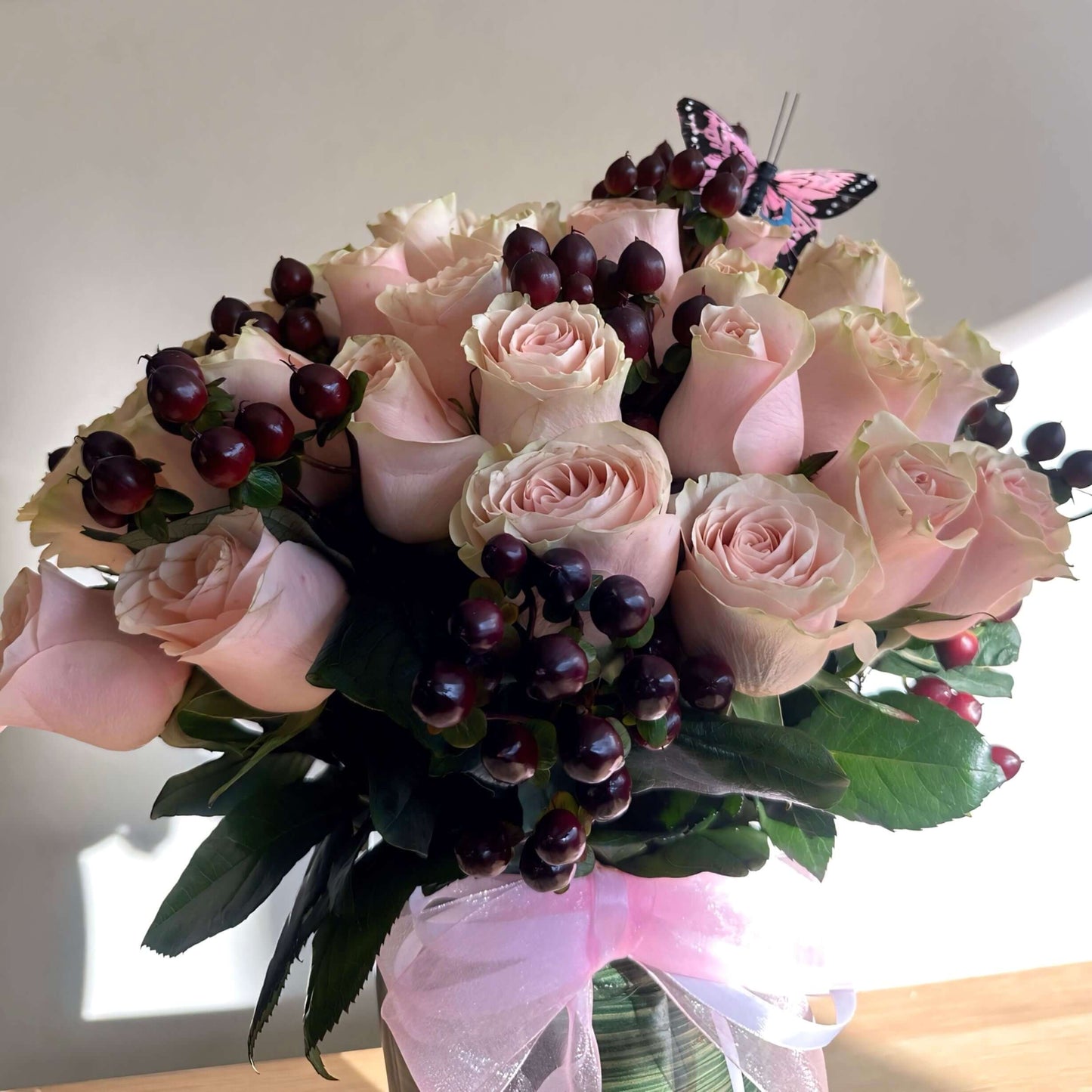 Elegant floral box with premium red roses, chocolates, and a personalized note for a special occasion