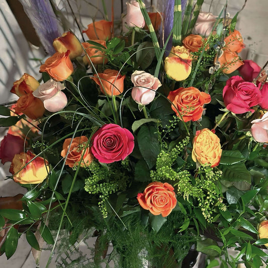 Handcrafted assorted rose bouquet and eucalyptus, symbolizing eternal love and admiration.