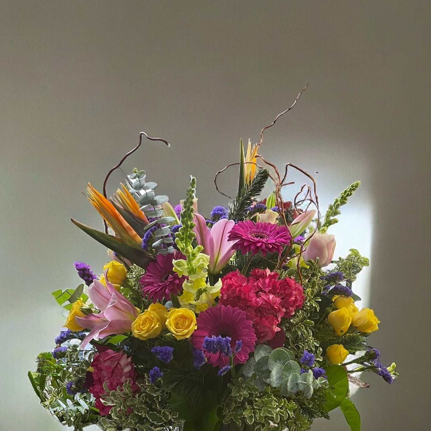 Vibrant Celebration Bouquet with exotic Birds of Paradise, lush greenery, and colorful blooms. Best luxury florists in Toronto.