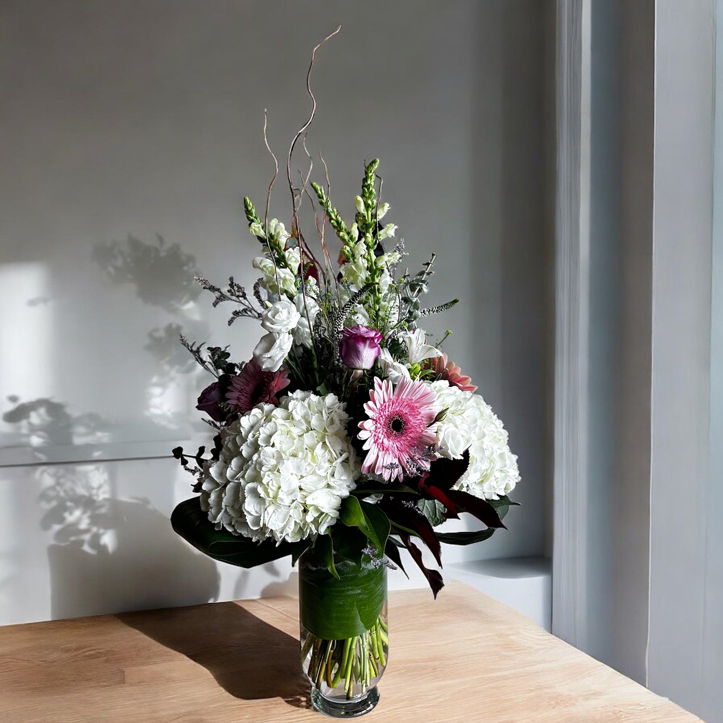 Luxury floral arrangement with white hydrangeas, pink blooms, greenery. Best Toronto florist, same day delivery, fresh elegance in bloom.
