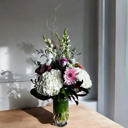 Luxury floral arrangement with white hydrangeas, pink blooms, greenery. Best Toronto florist, same day delivery, fresh elegance in bloom.