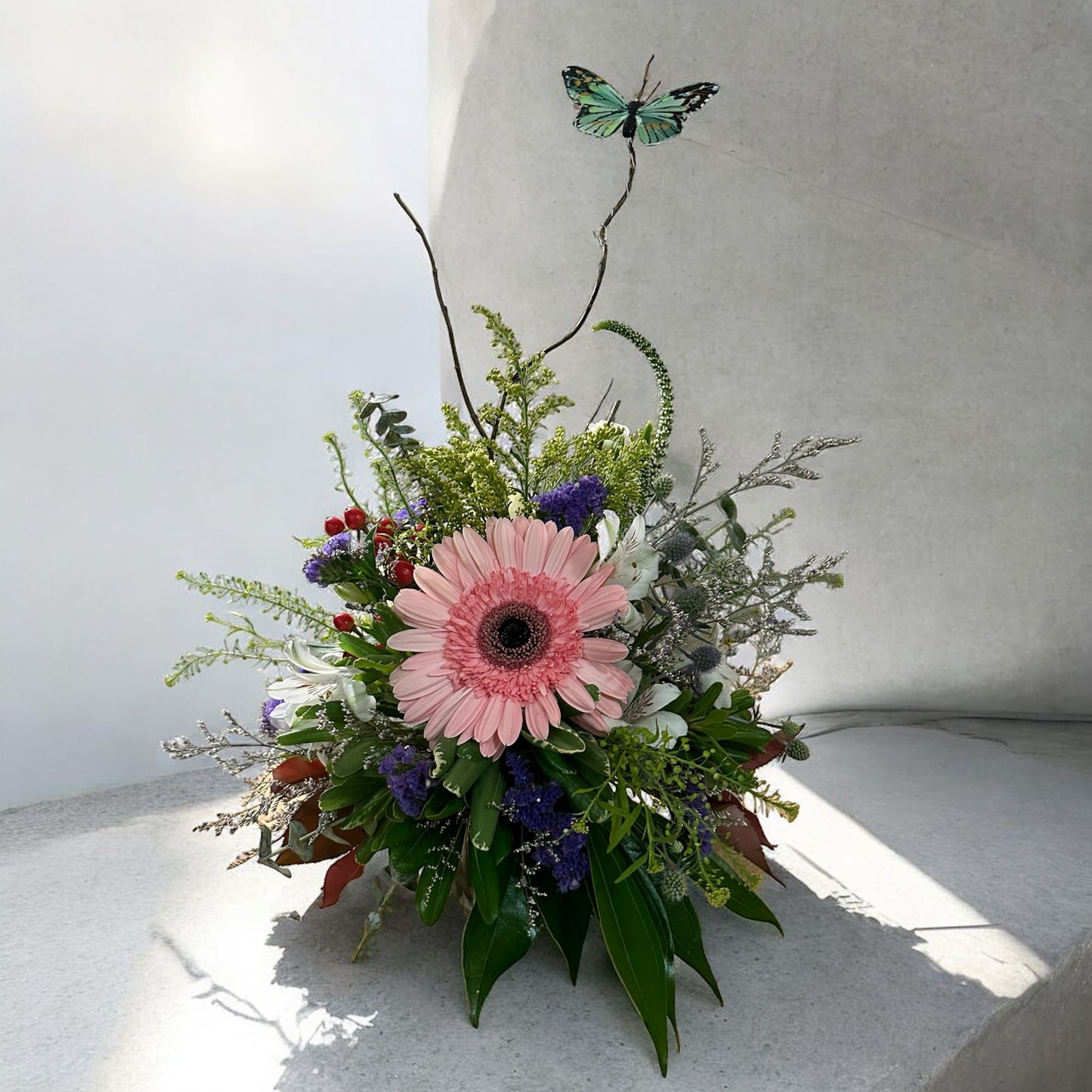 Aurora Delight bouquet with pink gerbera daisy, greenery, and butterfly accent by best Toronto and GTA florist, luxury arrangement, fresh.