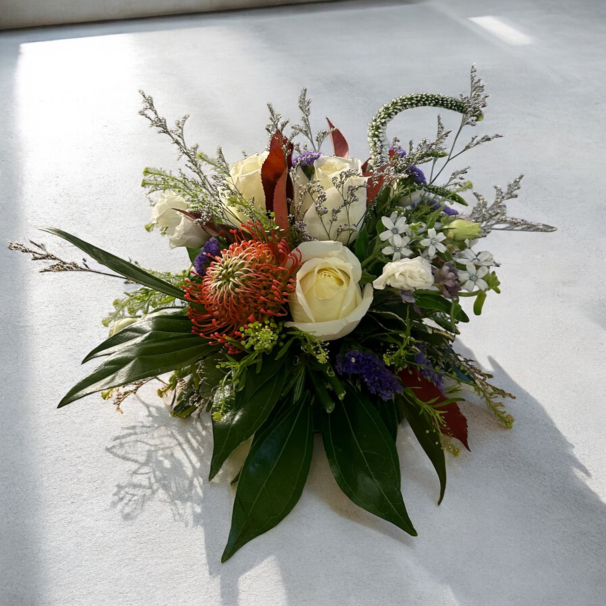 Autumn Bliss floral arrangement with elegant white roses, lush greenery, available for same day delivery by best Toronto and GTA florist.