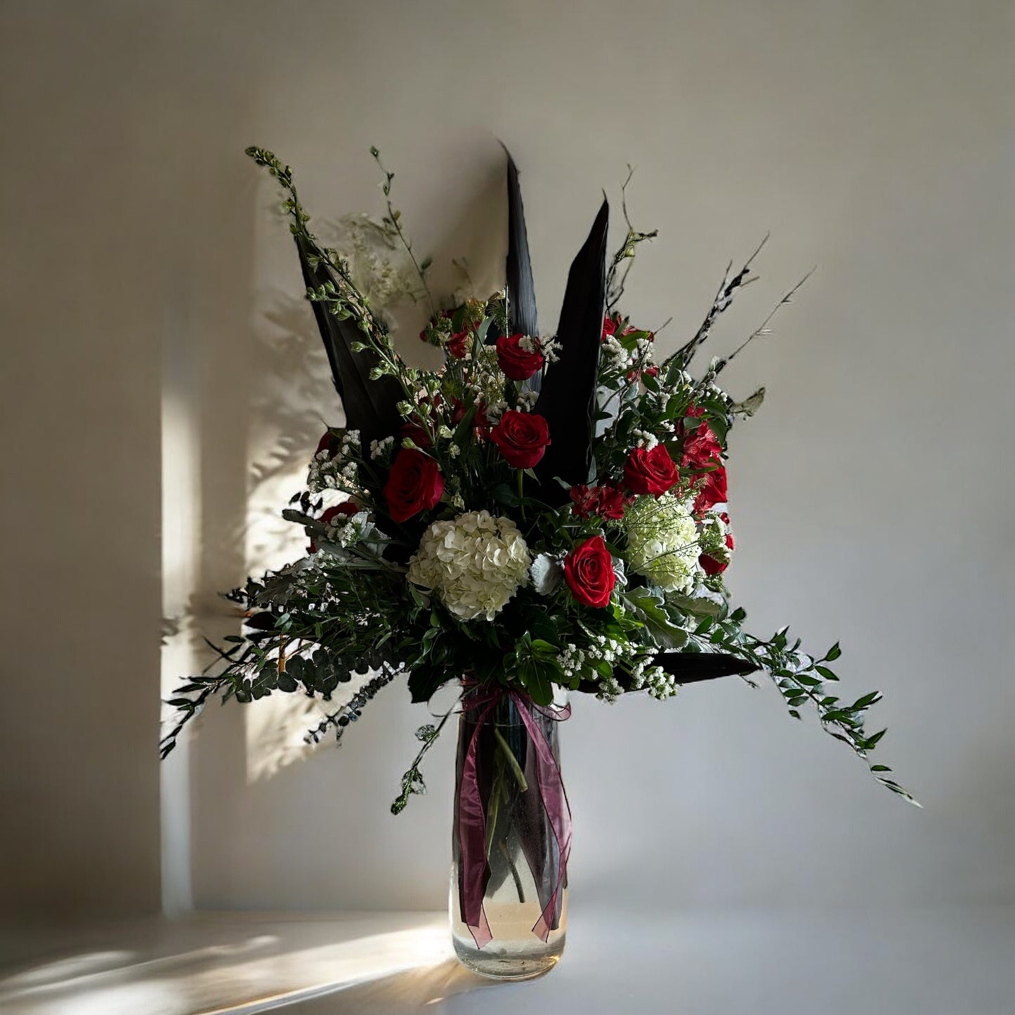Romantic Elegance Vase with red roses, hydrangeas, and greenery, perfect for luxury flower delivery in Toronto.