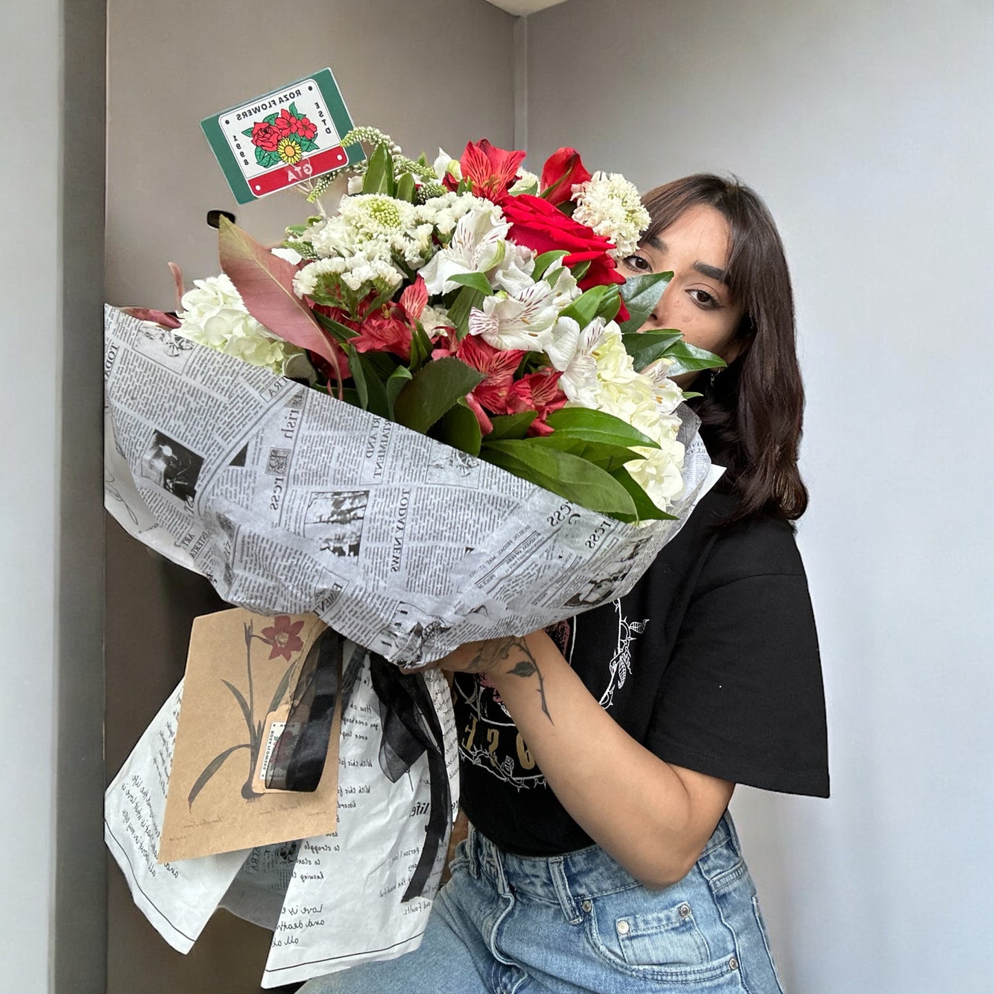 Handcrafted rose bouquet with delicate orchids and eucalyptus, symbolizing eternal love and admiration.