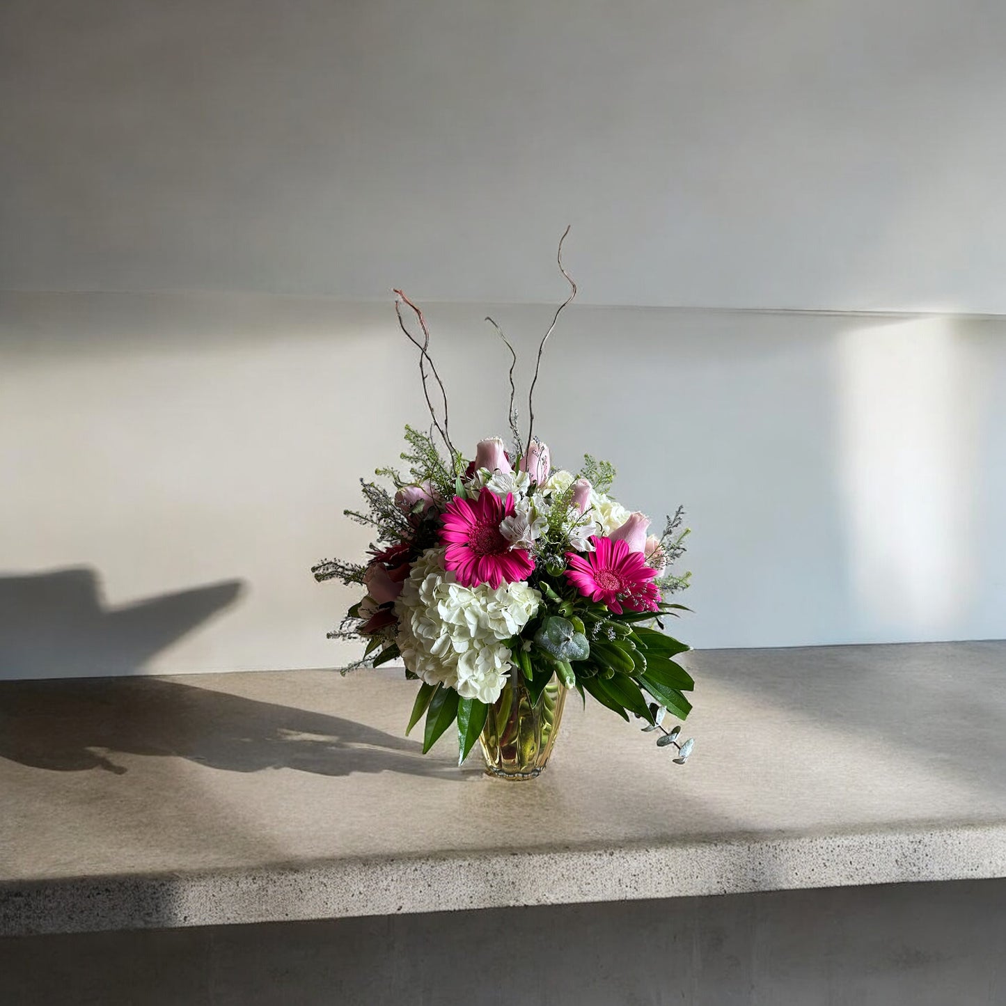 Blushing Elegance floral arrangement in a golden vase, perfect for luxury gifts in Toronto. Same day delivery available.