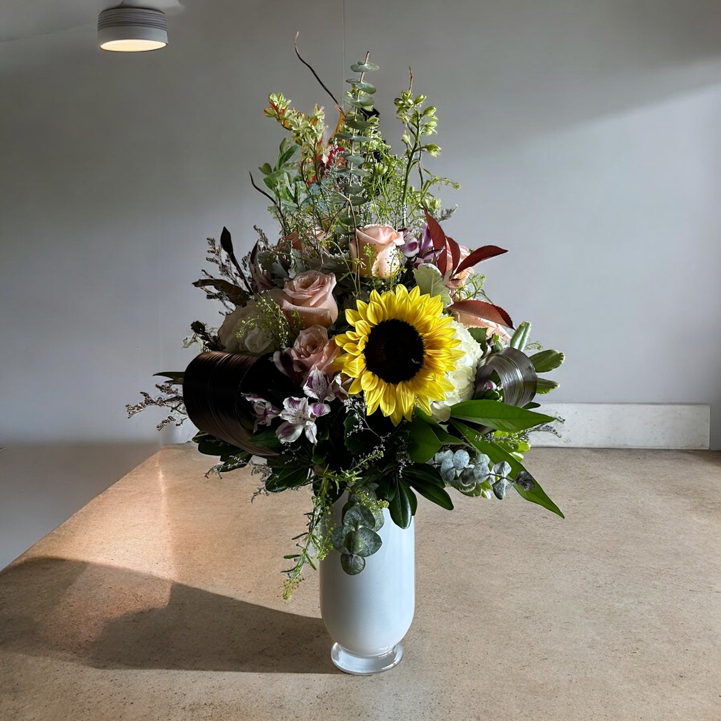 Golden Sunburst Vase with sunflower and roses, luxury flowers arrangement from the best flower shop in Toronto, same day delivery available.