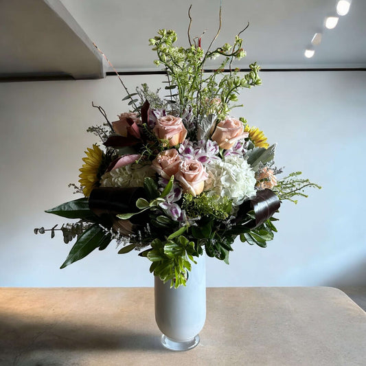 Golden Sunburst Vase filled with sunflowers, roses, and greenery, perfect for celebrations in Toronto with same-day delivery.