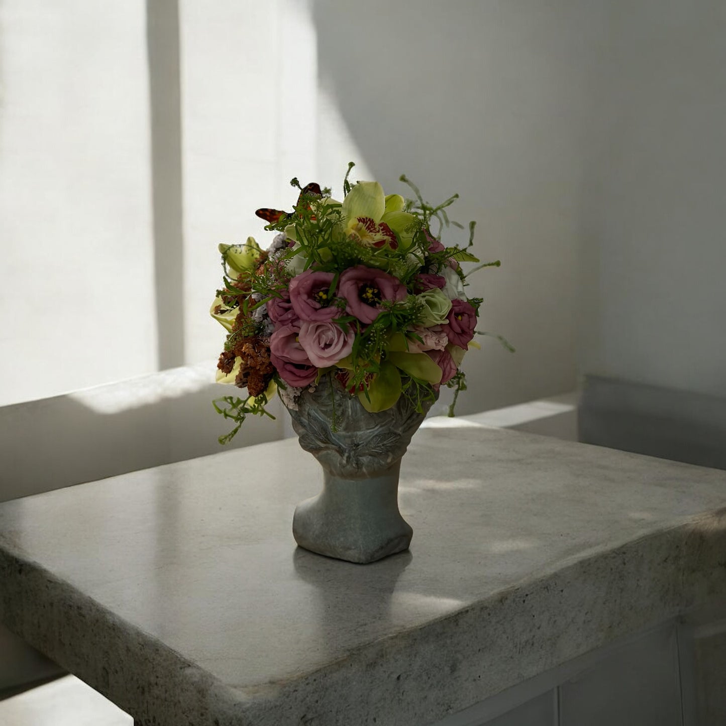 Chic and modern floral centerpiece with delicate orchids, perfect for sophisticated home or event decor.