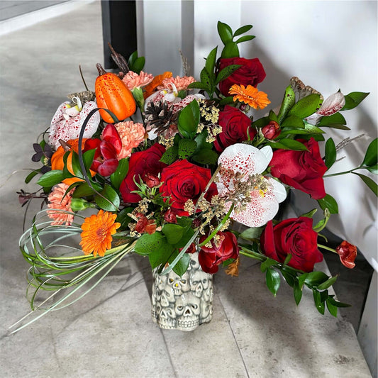 Vibrant mixed flower bouquet with bright gerbera daisies, roses, and fresh greenery, beautifully arranged for any special occasion.