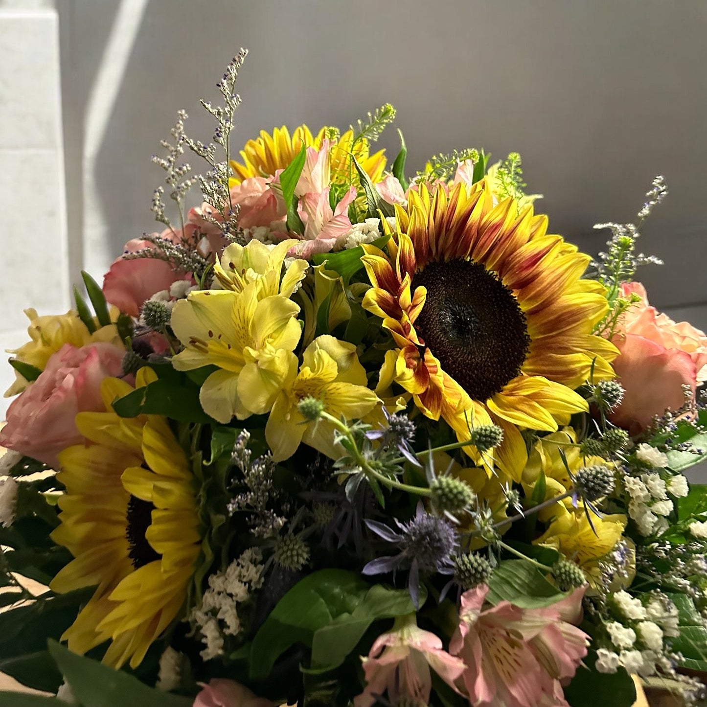 Sunlit Elegance Bouquet with vibrant sunflowers and pastel blooms, perfect for luxury flower delivery in Toronto.