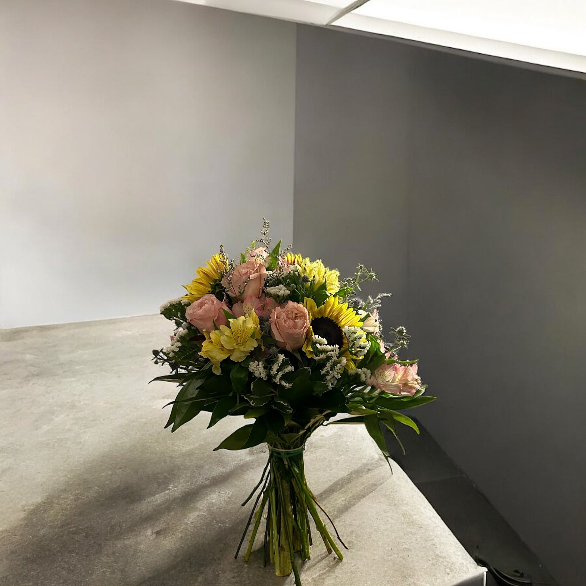 Sunlit Elegance Bouquet featuring sunflowers and roses, available at the best flowers shop in Toronto with same day delivery.