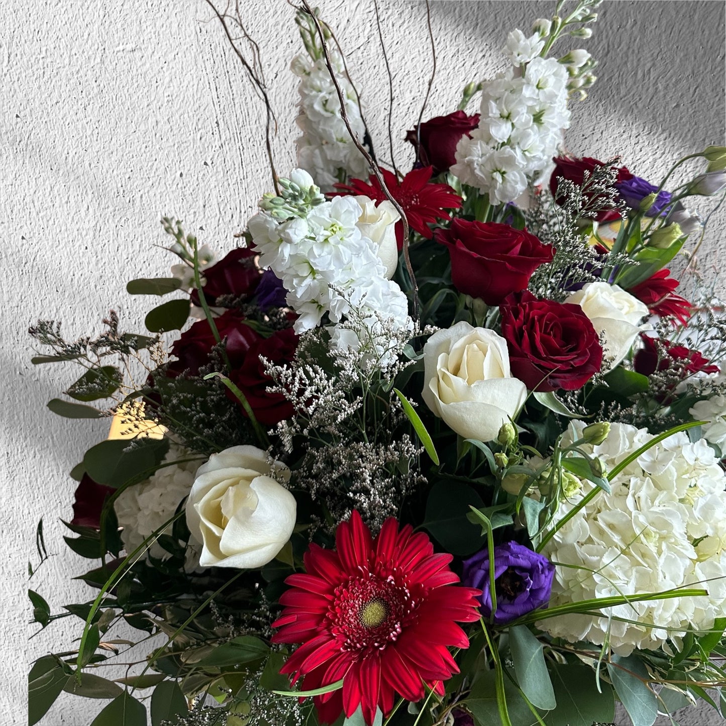 Majestic Elegance Vase with red roses, white flowers, and greenery, perfect for luxury floral arrangements in Toronto.
