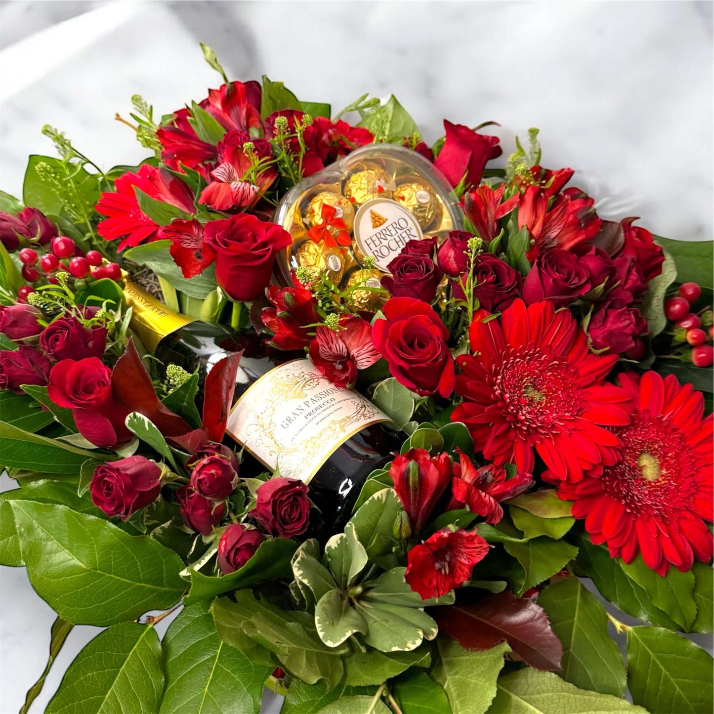 "Chic and modern floral centerpiece with delicate orchids, roses, and pampas grass – perfect for sophisticated home or event decor