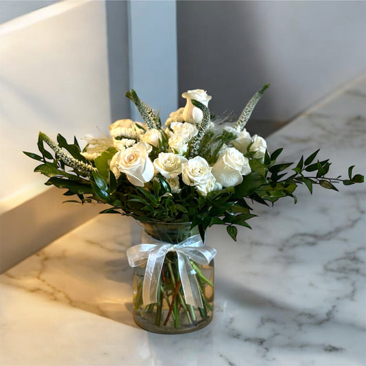 Ivory Elegance Vase with creamy white roses and lush greenery, perfect for all occasions. Available at the best florist in Toronto and GTA.