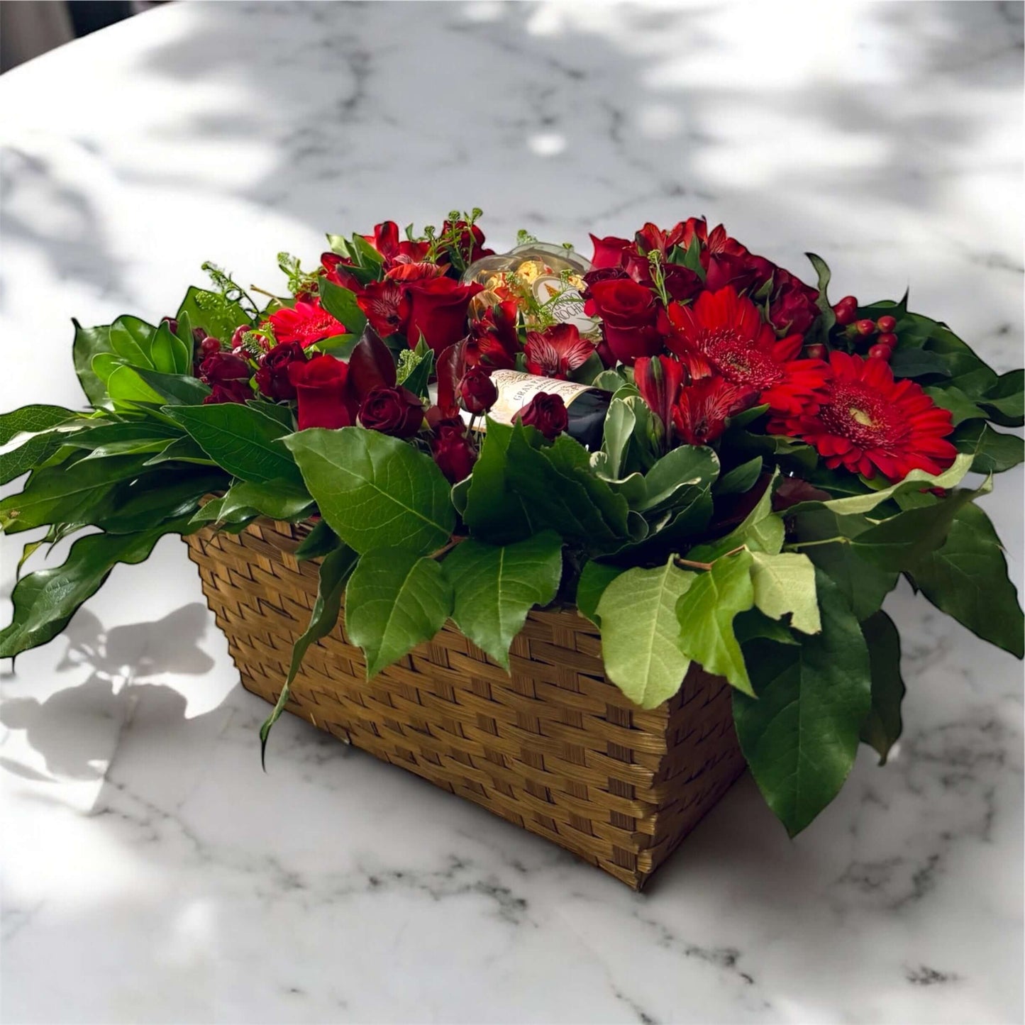 "Chic and modern floral centerpiece with delicate orchids, roses, and pampas grass – perfect for sophisticated home or event decor
