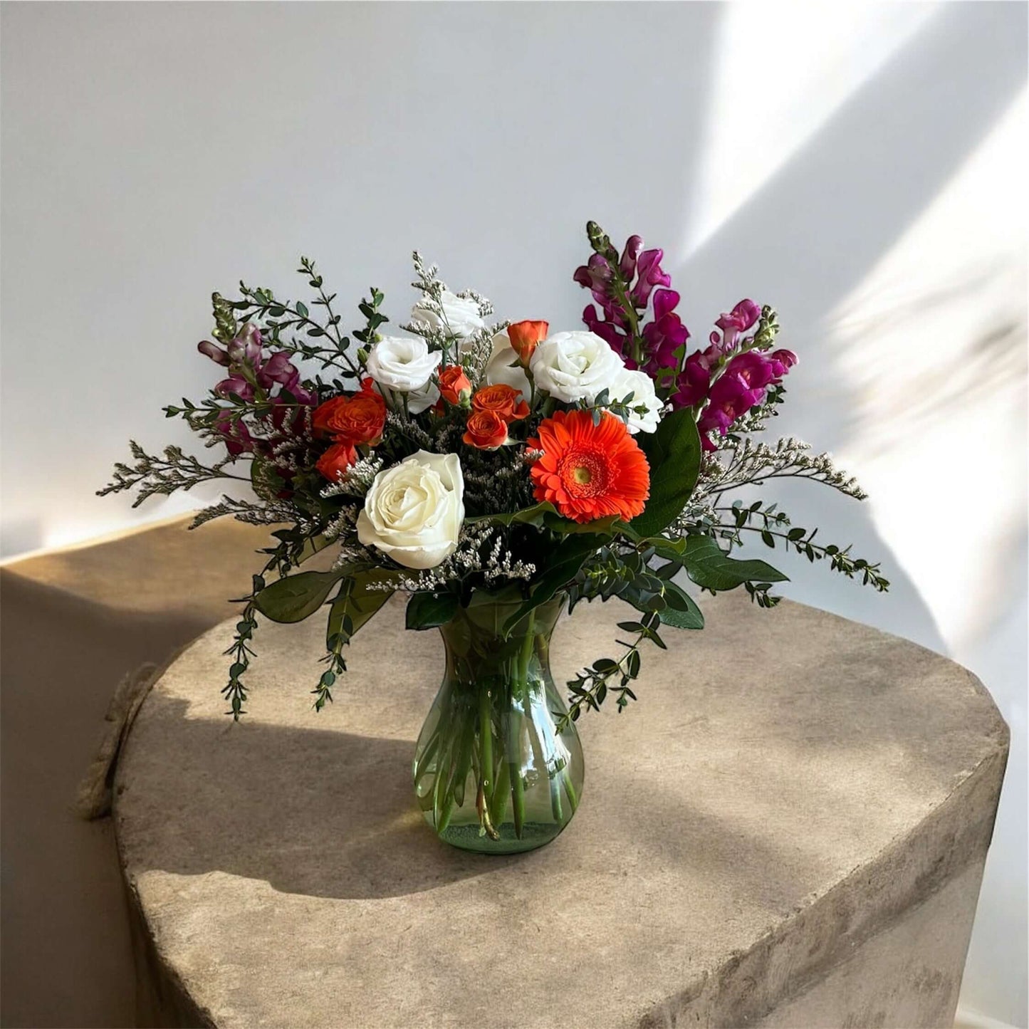 "Luxury floral bouquet with handpicked roses, hydrangeas, and greenery in a glass vase, ideal for weddings, anniversaries, and celebrations