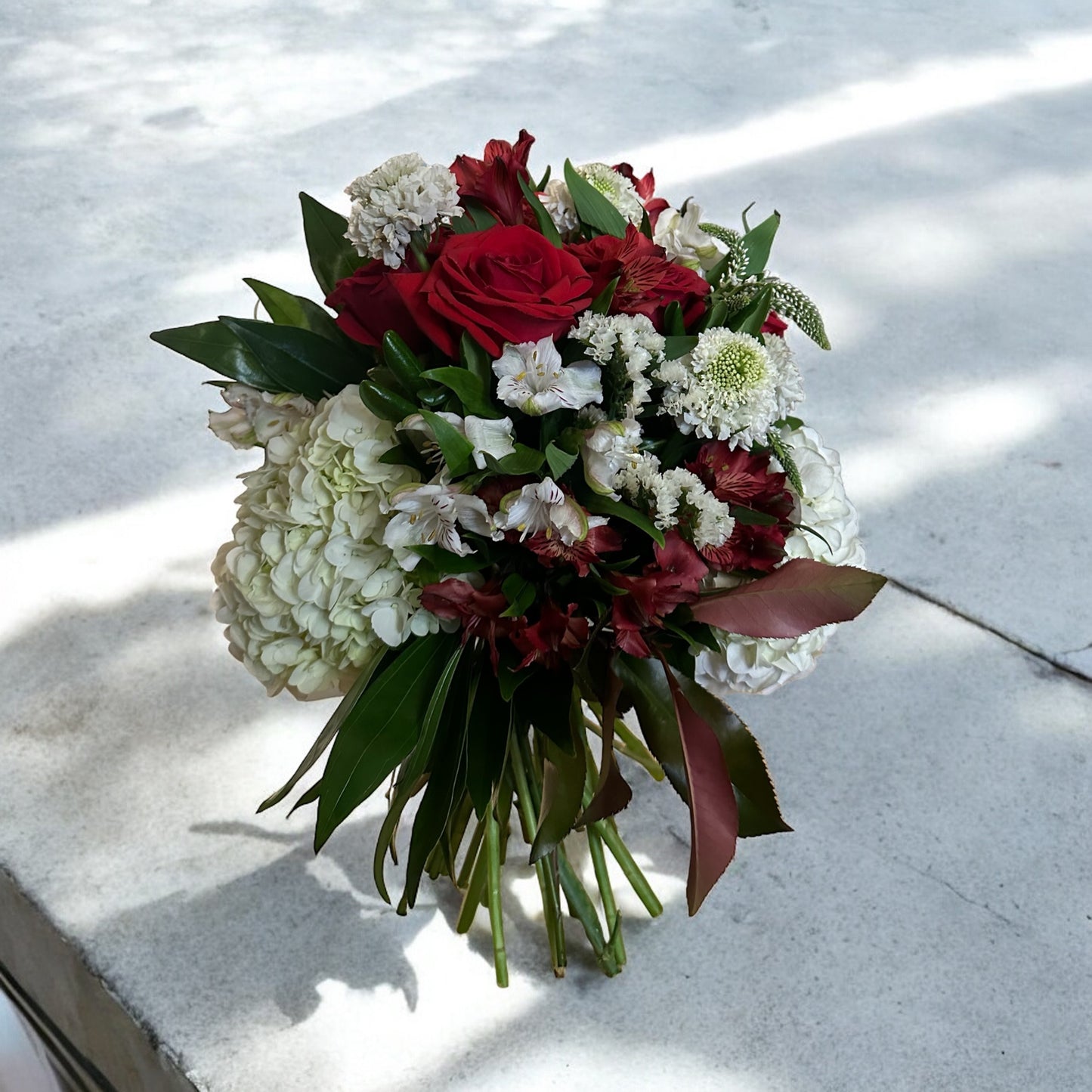 Handcrafted rose bouquet with delicate orchids and eucalyptus, symbolizing eternal love and admiration.