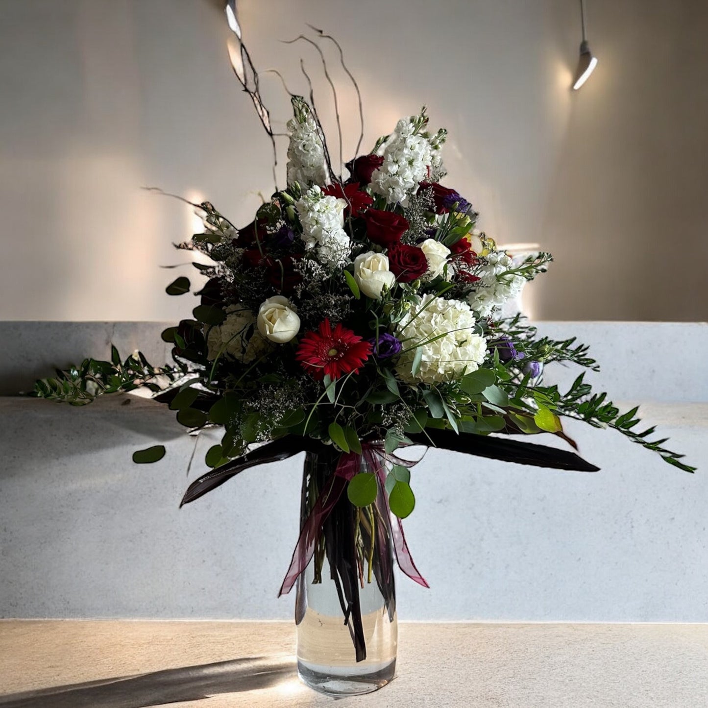 Majestic Elegance Vase with premium blooms in a striking arrangement, available for same day delivery in Toronto.