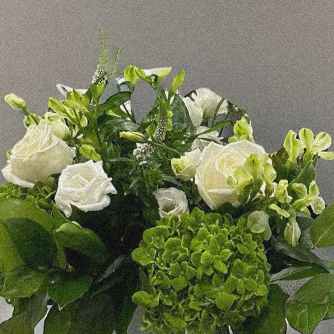 Luxury green and white floral arrangement with white roses for same-day delivery in Toronto. Perfect for any occasion.